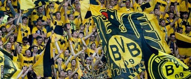 Dortmund fans cheer on their team