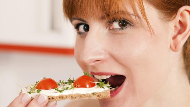 Woman eating cheese