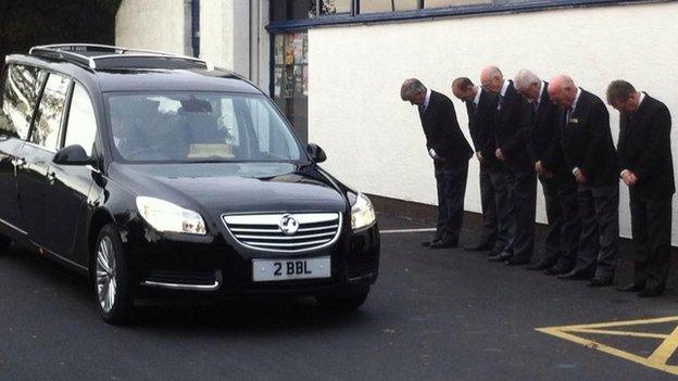 The hearse arrives at Lowther Pavilion