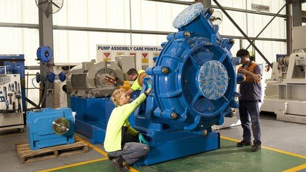 Weir Group staff working on pump