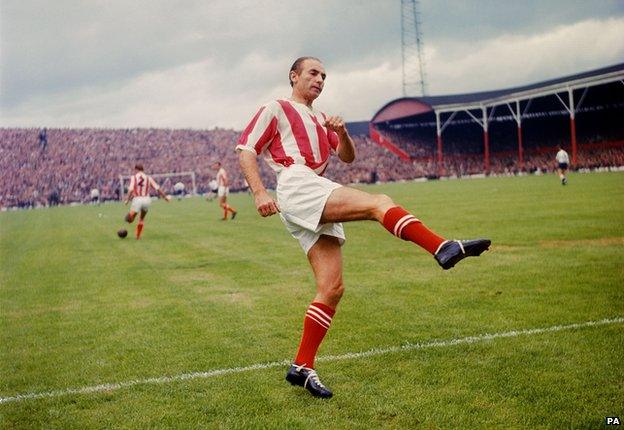 Sir Stanley Matthews warming up on the pitch in August 1963