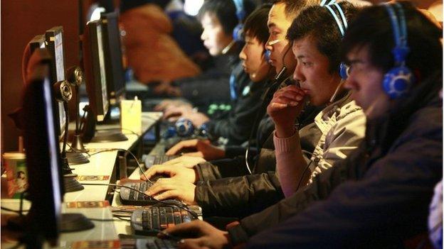 File photo taken Friday, Jan 15, 2010, people use computers at an Internet cafe in Fuyang in central China"s Anhui province