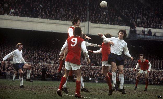 Arsenal's Charlie George and Frank McLintock in a tussle with Roy McFarland of Derby in 1972