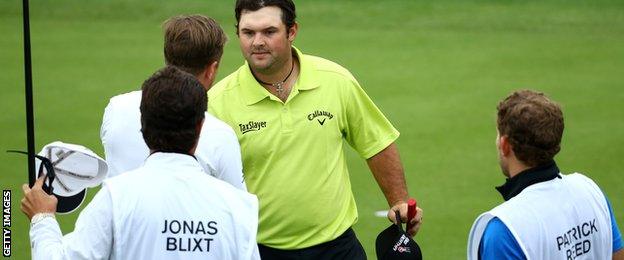 Jonas Blixt and Patrick Reed shake hands