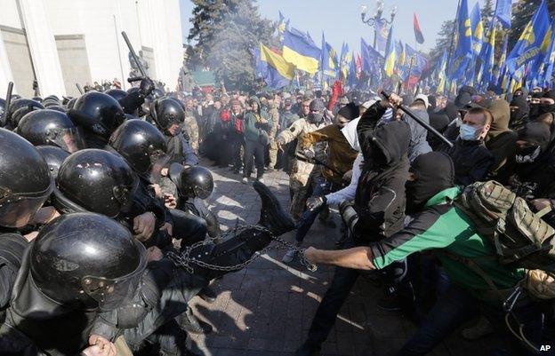 Far-right demonstrators clash with police outside parliament in Kiev over refusal by MPs to recognise a World War Two group as heroes (14 Oct)