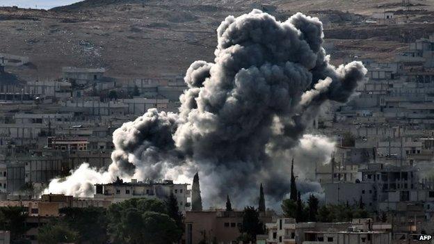 Smoke rises after an airstrike on Kobane