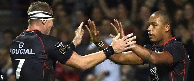 Imanol Harinordoquy and Gael Fickou celebrate a Toulouse try