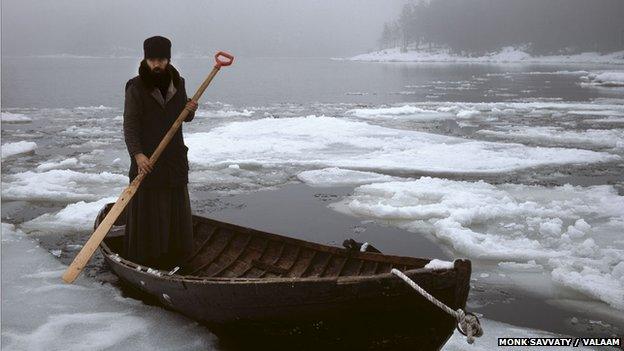 Monk on a boat