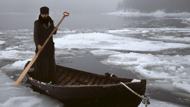 Monk on a boat