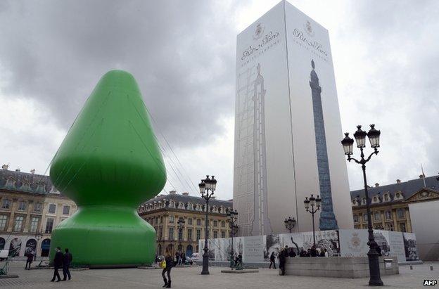 The sculpture entitled Tree by US artist Paul McCarthy on display at the Place Vendome in Paris, France, 16 October