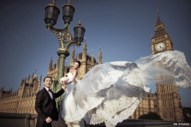 Bride and groom on Westminster Bridge