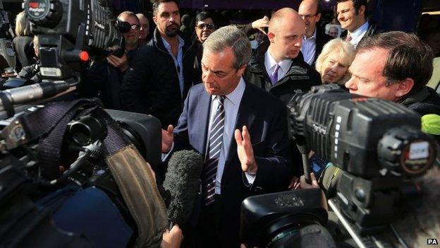 Nigel Farage speaks to the media