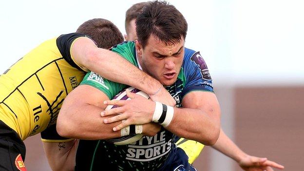 Connacht's Quinn Roux is challenged by Hamish Gard and Lancelot Luteau of La Rochelle