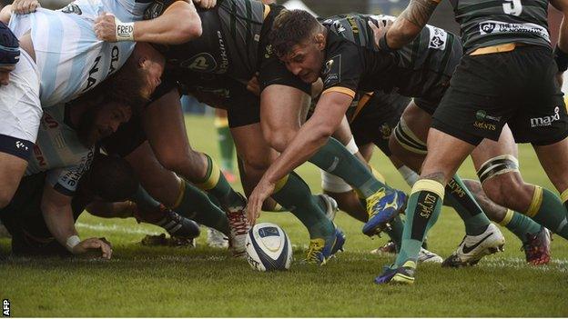 Northampton flanker Calum Clark can't resist using his hand as the ball squirts out of a scrum on Saturday