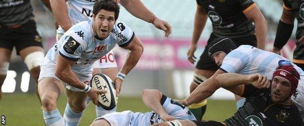 Maxime Machenaud passes the ball from the base of a ruck for Racing Metro