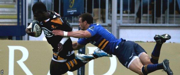 Christian Wade evades the despairing dive of Zane Kirchner to score for Wasps in their Champions Cup defeat by Leinster