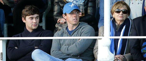 Rory McIlroy (centre) watches Leinster's win over Wasps in Dublin on Sunday