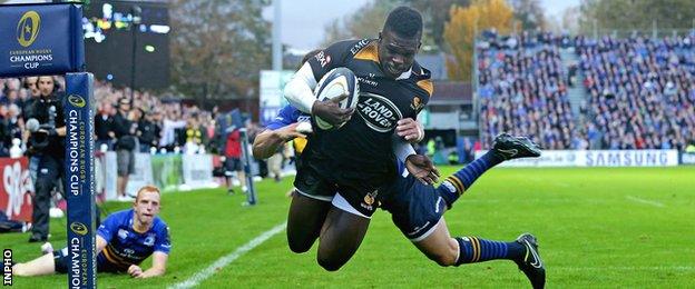 Christian Wade evades the despairing dive of Zane Kirchner to score for Wasps in their Champions Cup defeat by Leinster