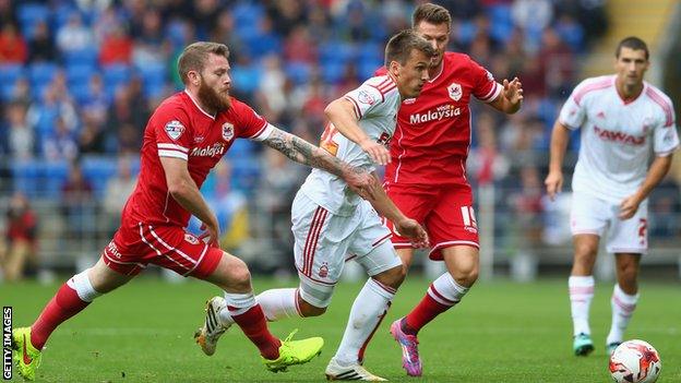 Cardiff's Aron Gunnarsson (left) closes down Robert Tesche of Nottingham Forest