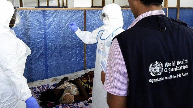 Health workers check patients at World Health Organization health centre in Liberian capital Monrovia. 3 October 2014