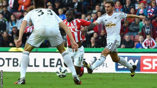 Stoke winger Victor Moses was awarded a penalty after this challenge by Swansea defender Angel Rangel