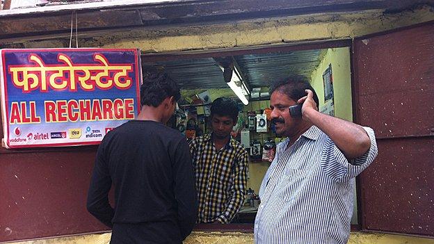 Man buys airtime at a small shop