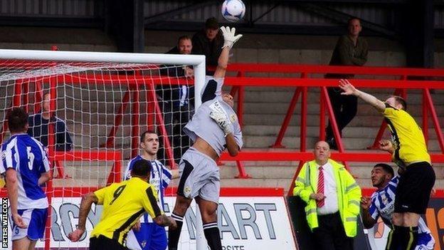 Worcester City stand-in keeper Wayne Thomas comes for a high ball in the 2-0 win over Harrogate