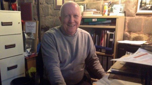 Robert Milton inside his office in the church