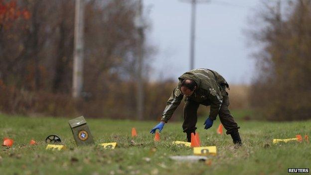 A Surete du Quebec officer investigates the scene