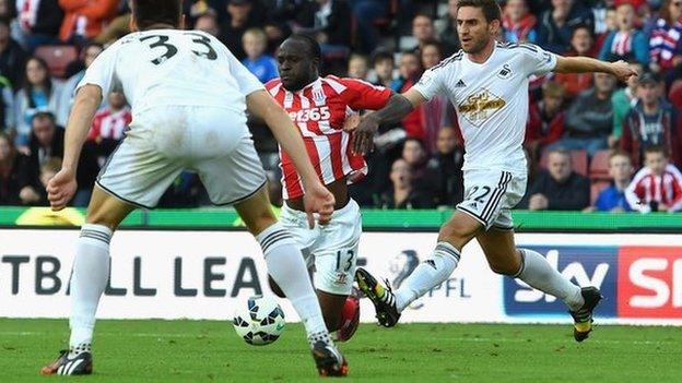 Stoke winger Victor Moses was awarded a penalty after this challenge by Swansea defender Angel Rangel