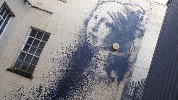 Banksy's Pierced Eardrum with paint thrown over it