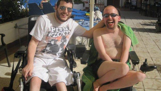 Ciaran sitting beside a swimming pool