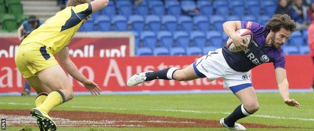 Colin Gregor scores a try for Scotland during the Glasgow Sevens