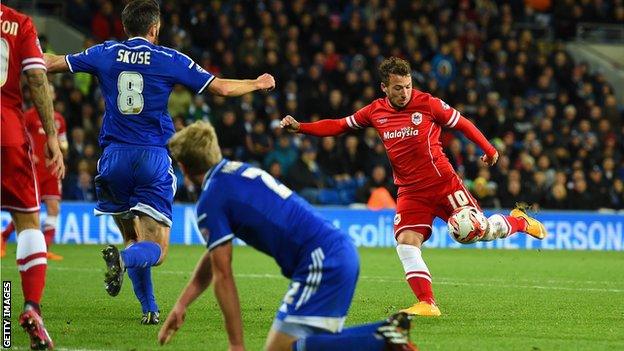 Adam Le Fondre prepares to shoot through a crowd of players to ensure the win for Cardiff against Ipswich