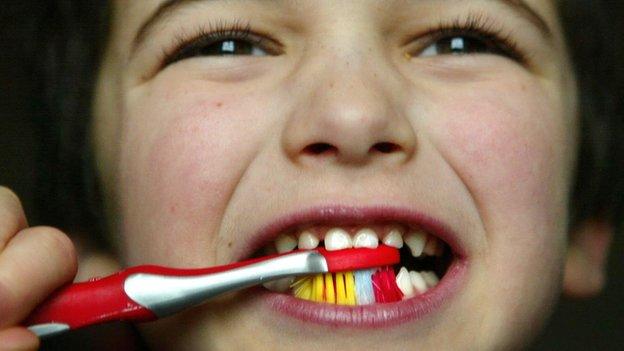 Boy brushing teeth