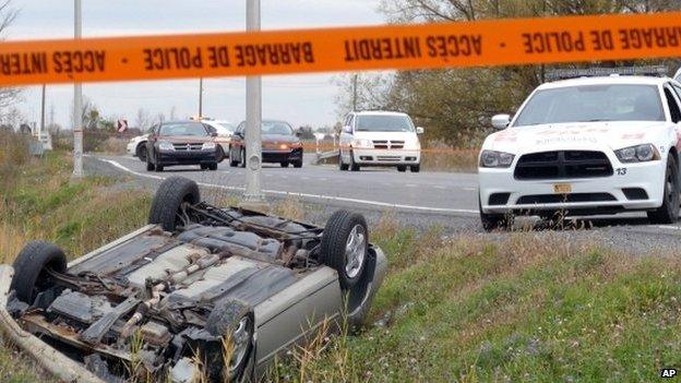 A car is overturned in the ditch in St-Jean-sur-Richelieu, Quebec, on 20 October 2014