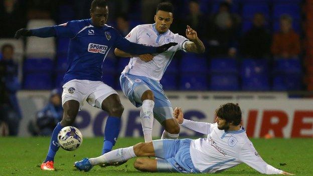 Jonathan Forte is tackled by two Coventry players at Boundary Park