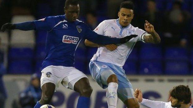 Jonathan Forte is tackled by two Coventry players at Boundary Park