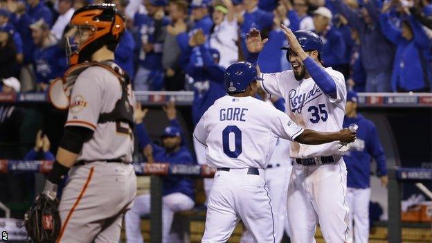 Terrance Gore celebrates with Royals team-mate Eric Hosmer after scoring a double in the sixth inning