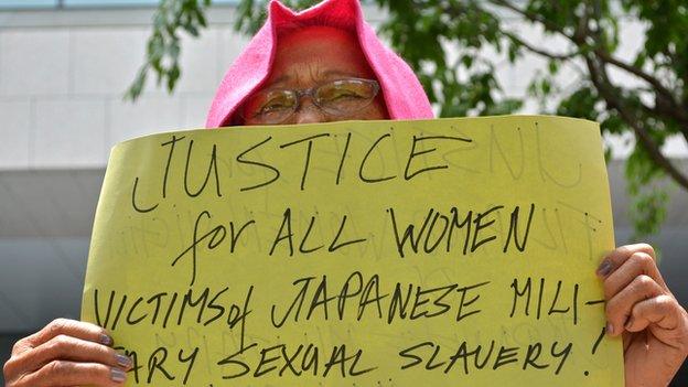 A former "comfort woman" demands justice near the parliament in Tokyo