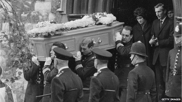 Policemen attending the funeral of three colleagues