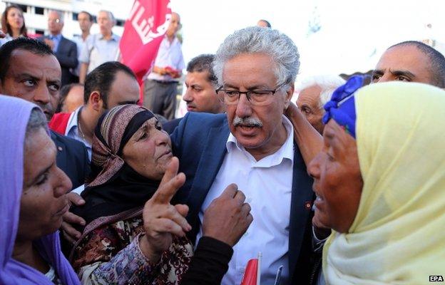 Tunisian leader of Popular Front party and its presidential candidate Hamma Hammami (C) with supporters during a parliamentary election campaign rally in Sousse south of Tunis ,Tunisia 16 October 2014.