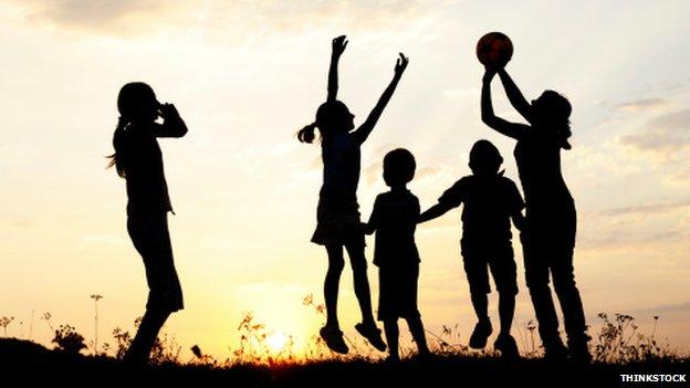 Children playing as the sun goes down