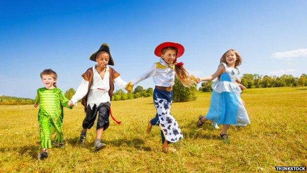 Young children running in a field