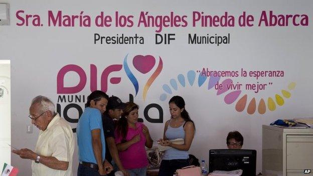 People work in the office of Maria de los Angeles Pineda Villa at the municipal headquarters in Iguala on 7 October, 2014.