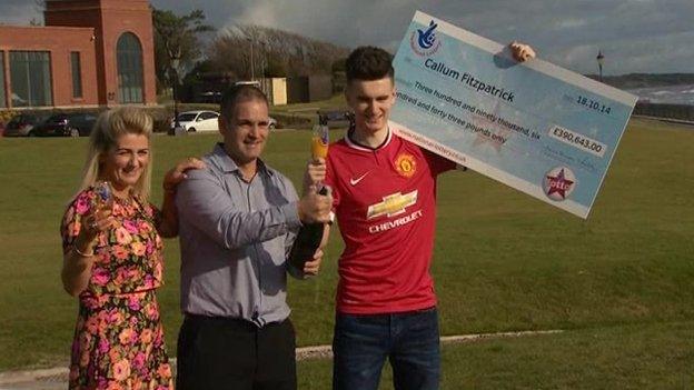 Callum Fitzpatrick holding cheque