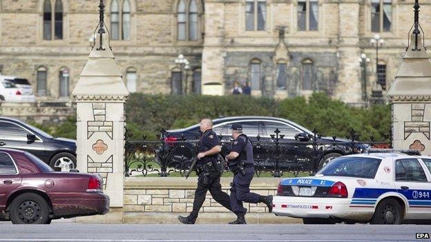 Emergency responders attempt to secure a portion of Parliament Hill after a shooting took place in Ottawa - 22 October 2014