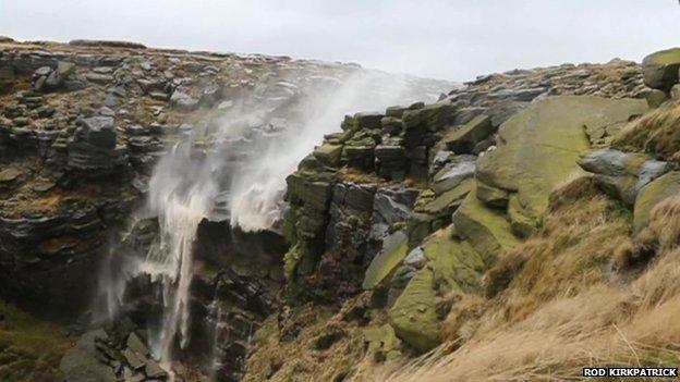 Kinder Downfall is blown backwards by powerful winds