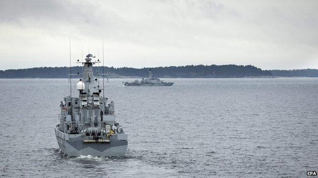 HMS Kullen (L) searches in the Stockholm archipelago on 19 October