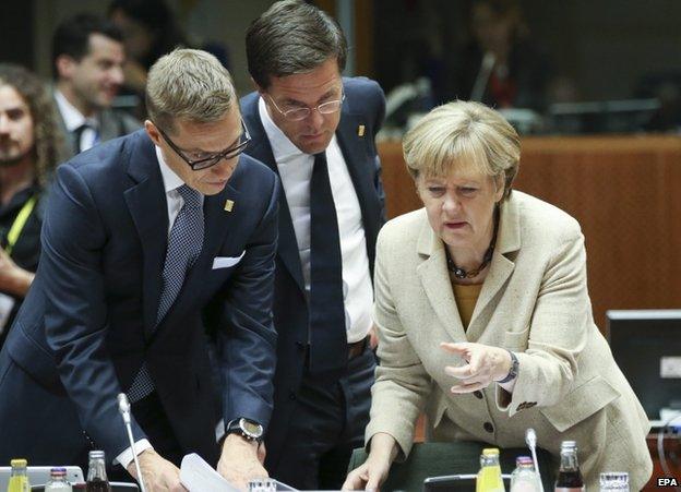 Alex Stubb of Finland (L) with Dutch PM Mark Rutte (C) and German Chancellor Angela Merkel